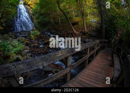 Hiking trail passes under Crabtree Falls on the Blue Ridge parkway near Asheville, North Carolina Stock Photo