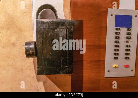 elevator with old buttons and coin receiver for elevator operation Stock Photo