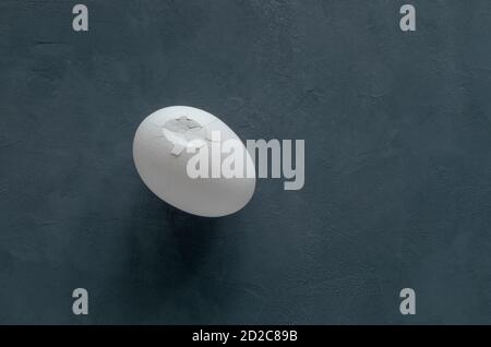 White broken chicken egg on a black background Stock Photo