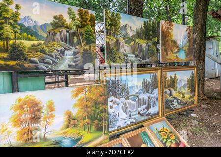 Tbilisi, Georgia - June 27 2019: Beautiful paintings at the Dry Bridge Market in the city center of Tbilisi on a sunny day Stock Photo