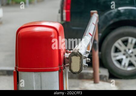 automatic red-white barrier in the yard close-up during daylight hours Stock Photo