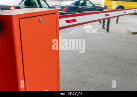 automatic red-white barrier in the yard close-up during daylight hours Stock Photo
