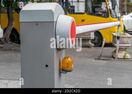 automatic red-white barrier in the yard close-up during daylight hours Stock Photo