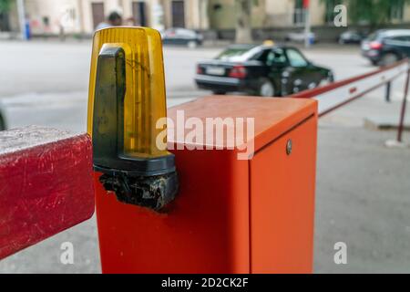 automatic red-white barrier in the yard close-up during daylight hours Stock Photo