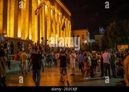 Tbilisi, Georgia - June 29 2019: People near the parliament in Tbilisi at night, protests, peaceful rallies. Freedom of speech concept Stock Photo