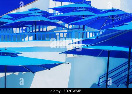 Blue umbrellas at the Arab cafe, Sidi Bou Said, Tunisia Stock Photo