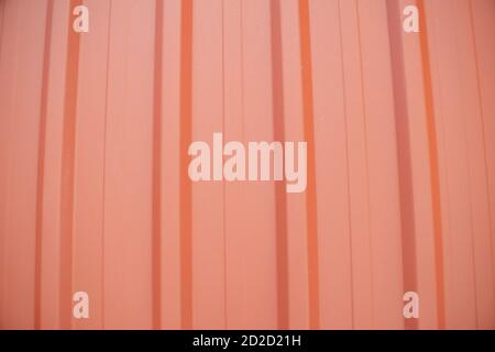 Orange metal sheet roof texture pattern background, vertical stripes Stock Photo