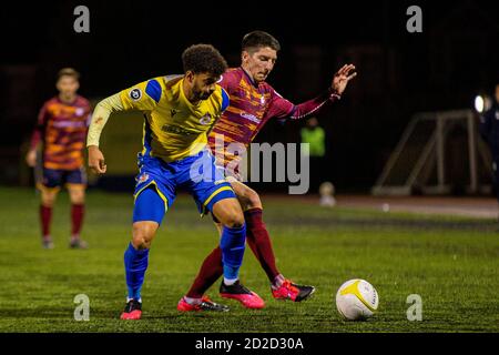Barry, Wales, UK. 6th Oct, 2020. Theo Wharton of Barry Town in action against Harry Warwick of Cardiff Met. Barry Town United v Cardiff Met at Jenner Park in the JD Cymru Premier on the 6th October 2020. Credit: Lewis Mitchell/Alamy Live News Stock Photo