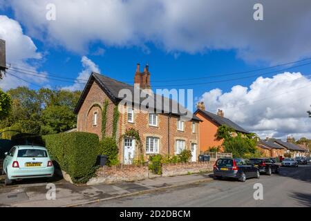 Roadside cottage with attractive local style patterned brickwork in Great Bedwyn, a village in east Wiltshire, southern England, on a sunny day Stock Photo