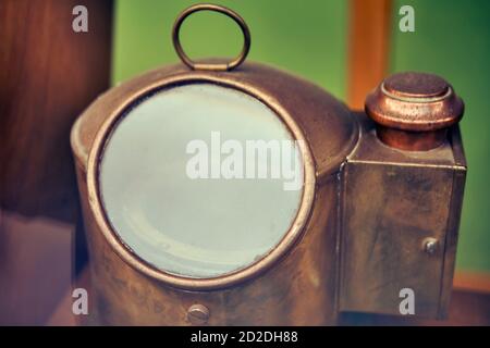 Vintage yellow metal deck ship lantern, close-up Stock Photo