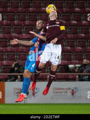 Betfred Cup - Heart of Midlothian v Inverness Caledonian Thistle,.  Tynecastle Park, Edinburgh, Midlothian, UK.  06/10/2020. Hearts play host to Inverness Caledonian Thistle in the Betfred Cup at Tynecastle Park, Edinburgh. Pic shows: Inverness Caley midfielder, James Vincent, and Hearts' defender, John Souttar , go up for the ball, Credit: Ian Jacobs Stock Photo