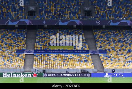 KYIV, UKRAINE - SEPTEMBER 29, 2020: Empty tribunes of NSC Olimpiyskyi stadium in Kyiv during the UEFA Champions League play-off game Dynamo Kyiv v Gent Stock Photo