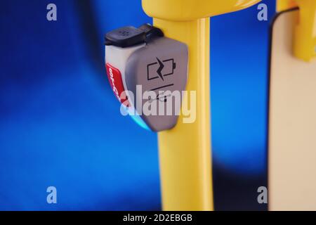 Mobile phone charger with usb in public transport and stop button Stock Photo