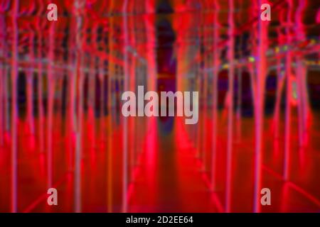 Blurred background in red with a road between the vertical lines, Halloween design corridor Stock Photo