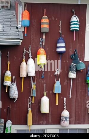 Lobster Buoys displayed on outdoor wall. Stock Photo