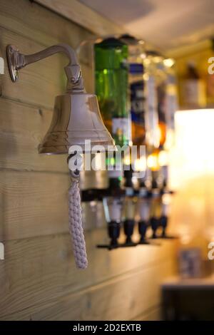 Pub bell with spirits in optics Stock Photo