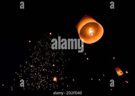 Floating lanterns on sky in Loy Krathong Festival or Yeepeng Festival , traditional Lanna Buddhist ceremony in Chiang Mai, Thailand Stock Photo