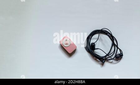 mp3 player with earphone isolated on white background Stock Photo - Alamy