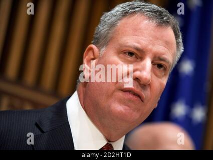 NEW YORK, NY - DECEMBER 22: New York City Mayor Bill de Blasioand New York Police Department Commissioner Bill Bratton speak at a press conference regarding two police officers who were killed on Saturday on December 22, 2014 in New York, NY. Tensions between the Mayor and the New York Police Department (NYPD) have been high after de Blasio sympathized with protesters who took to the streets after grand juries declined to charge white officers in the killings of unarmed black males. Police commissioner Bill Bratton urged to ease those strains in the wake of the shooting of NYPD officers, Wenji Stock Photo