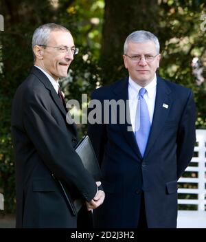 John Podesta (L), co-chairman of Barack Obama's transitional team stands with White House Chief of Staff Joshua Botlen as U.S. President George W. Bush meets with U.S. President-elect Barack Obama at the White House in Washington, DC, November 10, 2008.    REUTERS/Joshua Roberts    (UNITED STATES)