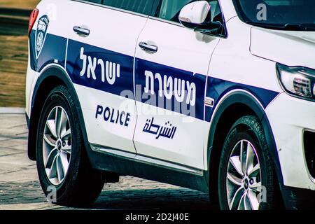Closeup of an official police car patrolling the streets of the city center of the metropolitan area Stock Photo