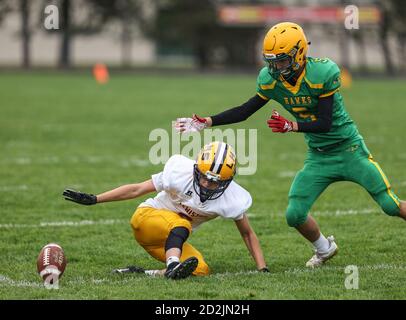 Tackle football action with Lewiston vs Lakeland High School freshmen teams in Rathdrum, Idaho. Stock Photo