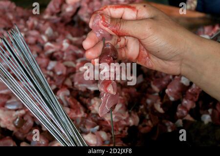 Satay Klatak making process. Sate klathak is a unique goat satay or ...