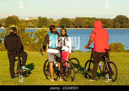 Arlington, VA, USA 10/02/2020: A group of young African American men are on their bike before a leisurely cycling trip in Gravelly point park by the p Stock Photo