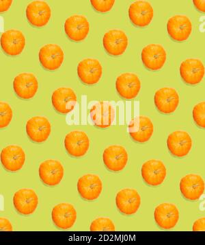 Seamless pattern with pumpkin. Autumn abstract seamless pattern made from Pumpkins on the green background. Pumpkin quality pattern. Stock Photo
