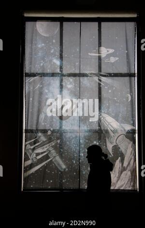 A woman walks through an exhibition in the former 'Vengeance Weapon 2' or 'V2'  rocket testing site's power station in Peenemuende, March 7, 2008.  Few Germans know the global space race started on a remote and sandy island off the Baltic coast with little to distinguish it aside from wide open skies and a carpet of pine trees. But it was at Peenemuende in 1942 that a team of engineers under Wernher von Braun tested the world's first long-range ballistic missiles, or rockets, for the Nazis and laid the foundations for sending man to the moon and Cold War missiles. Picture taken March 7.TO ACCO