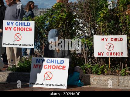 Up to 100 people gathered on October 5th 2020 outside the United States Courthouse in Boston, MA to protest a Massachusetts state law requiring all children attending public school to have been vaccinated against influenza (flu). Stock Photo