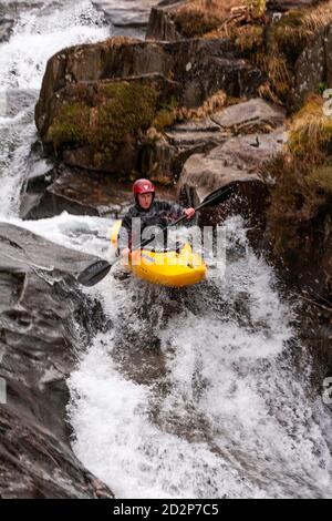 Canoeist in White Water, Snowdonia, North Wales Stock Photo