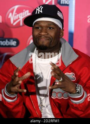 Rapper 50 Cent From The U S Holds Up A Condom During A Media Briefing At Lanseria Airport Outside Johannesburg April 30 08 50 Cent Together With His G Unit Crew Will Perform Twice