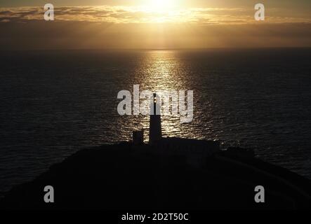 Sunset over South Stack Lighthouse, Anglesey Stock Photo