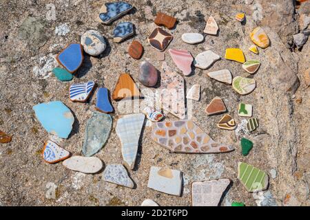 Multicolored pieces of tiles, rounded by the sea. Peniche, Portugal Stock Photo