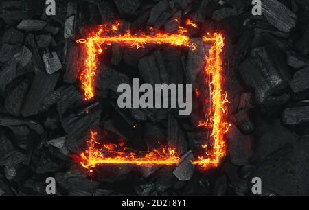 flat lay design of square frame in fire over black charcoal pieces Stock Photo