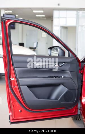 Russia, Izhevsk - August 06, 2020: Mazda showroom. Details of driver door new modern CX-5 car. Famous world brand. Modern transportation. Stock Photo
