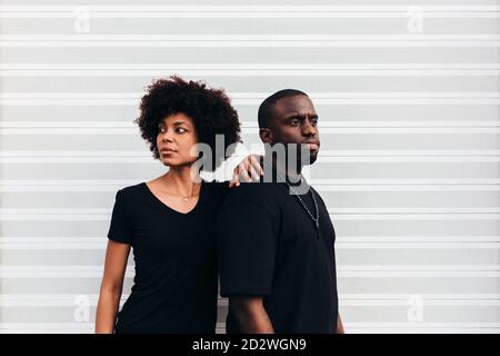 Black cool couple posing over white background looking at camera Stock Photo