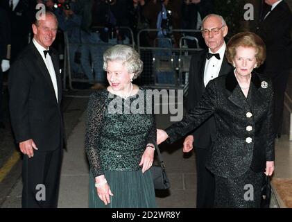 The Queen and Baroness Thatcher (right), together with the Duke of Edinburgh (left) and Dennis Thatcher, enter Claridge's in London for a glittering dinner tonight (Monday) to celebrate the former Prime Minister's 70th birthday Baroness Thatcher greeted the Queen warmly, laying to rest past speculation that the two women did not get on with each other. See PA Story ROYAL Thatcher. Stock Photo