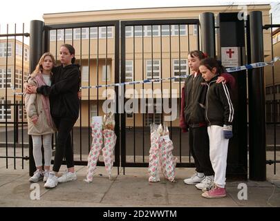 Shocked Children Gather Outside The Gates Of St George's School In 