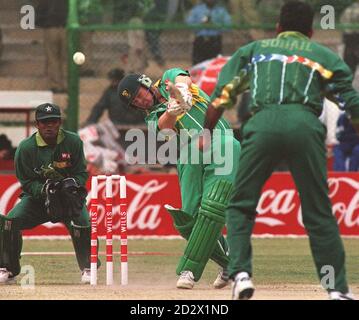 On the attack, Daryl Cullinan who top scored for South Africa blasts the bowling of Amir Sohail as the South Africans defeated Pakistan in the Cricket World Cup in Karachi. Stock Photo