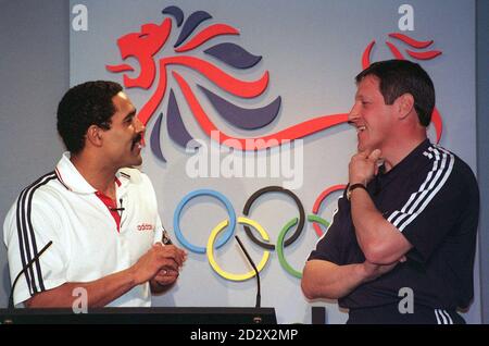 Former Olympic athlete Daley Thompson (left) and Allan Wells talk at launch of the official kit for the British team going to the Atlanta Olympics. Stock Photo