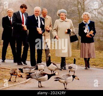 HM The Queen followed by HRH The Duke of Edinburgh with Director General Dr. Myrfyn Owen (front left) and Lady Phillipa Scott during today's (friday) visit to The Wildfowl and Wetlands Trust, Slimbridge. Stock Photo