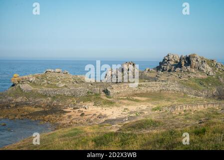 Remains of the fortification and constructions of the Celtic fortress of Baronha in a coastal peninsula of Porto do Son Galicia Stock Photo