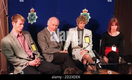 Mike and Ann Elliott (cen), parents of student Caroline who was knocked down and killed while out jogging with her friend Sarah Edenbrow a week ago, pictured at a news conference in Liverpool today (Thur). Mr Elliott and his wife had travelled to Liverpool from their St Albans home to make their appeal for anyone shielding the stolen car driver who killed the 22-year-old Caroline and seriously injured 21-year-old Sarah, to give him up. Also pictured are the Elliotts' other children David (20) and Katherine (23. See PA story POLICE Jogger. PA. Stock Photo