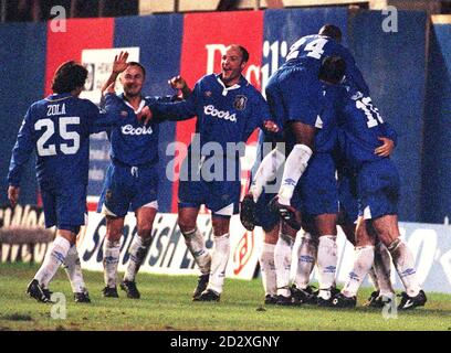 Chelsea's goalscorer Zola (left) joins teammates Dennis Wise (2nd left) and Frank Leboeuf  (centre) to congratulate Gianluca Vialli (hidden right), after he scored his second goal against Liverpool at Stamford Bridge today (Sunday), bringing the final score to 4-2. Photo by Adam Butler. Stock Photo