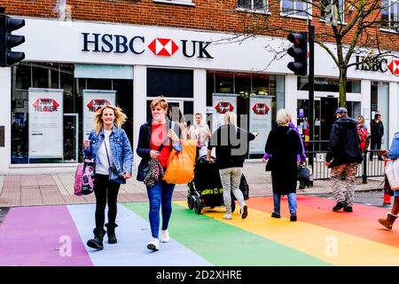London UK October 06 2020, People Crossing A Rainbow Road Crossing Infront Of A Branch Of HSBC Bank During COVID-19 Stock Photo
