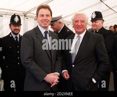 Labour leader Tony Blair (left) with film director Michael Winner, who is chairman of the  Police Memorial Trust after the unveiling of a memorial in Ilford, East London,  to PC Phillip Walters who was shot dead two years ago after answering a 999 call. Stock Photo