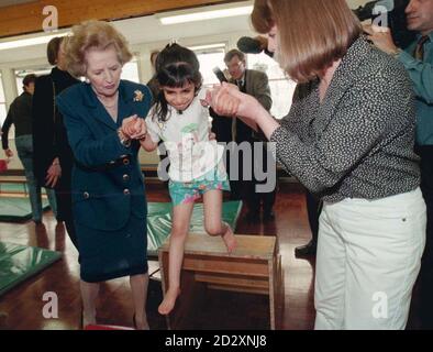 Baroness Thatcher helps a pupil over the box in the gym at Whitefield School in Walthamstow, Britain's biggest centre for children with severe learning difficulties, during her visit this morning (Mon). See PA story ELECTION Thtatcher.  Picture by Stefan Rousseau/PA Stock Photo