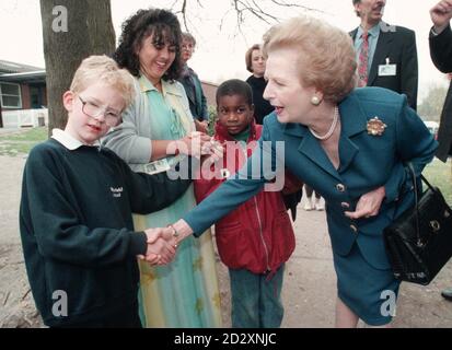 Baroness Thatcher meets Jonathan Weaver, a pupil at Whitefield School in Walthamstow, North London,  Britain's biggest centre for children with severe learning difficulties, during her visit this morning (Mon). See PA story ELECTION Thtatcher.  Picture by Stefan Rousseau/PA Stock Photo